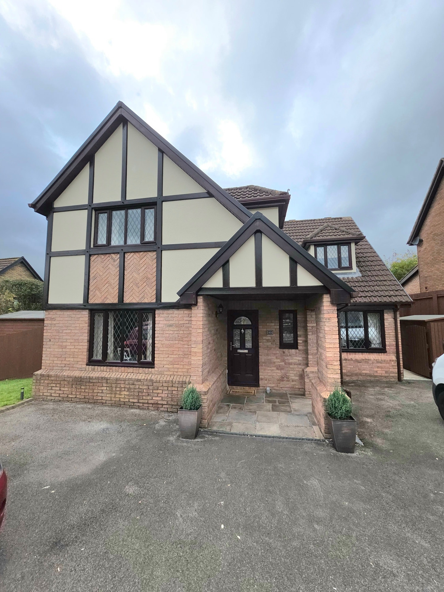 Front elevation of a detached home after full exterior repaint in Newport