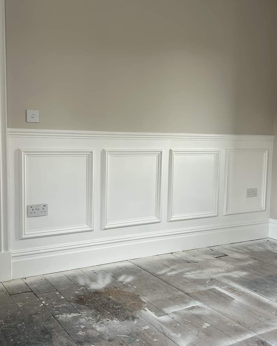 Crisp white wall panelling and skirting in a beige hallway — South Wales woodwork painting