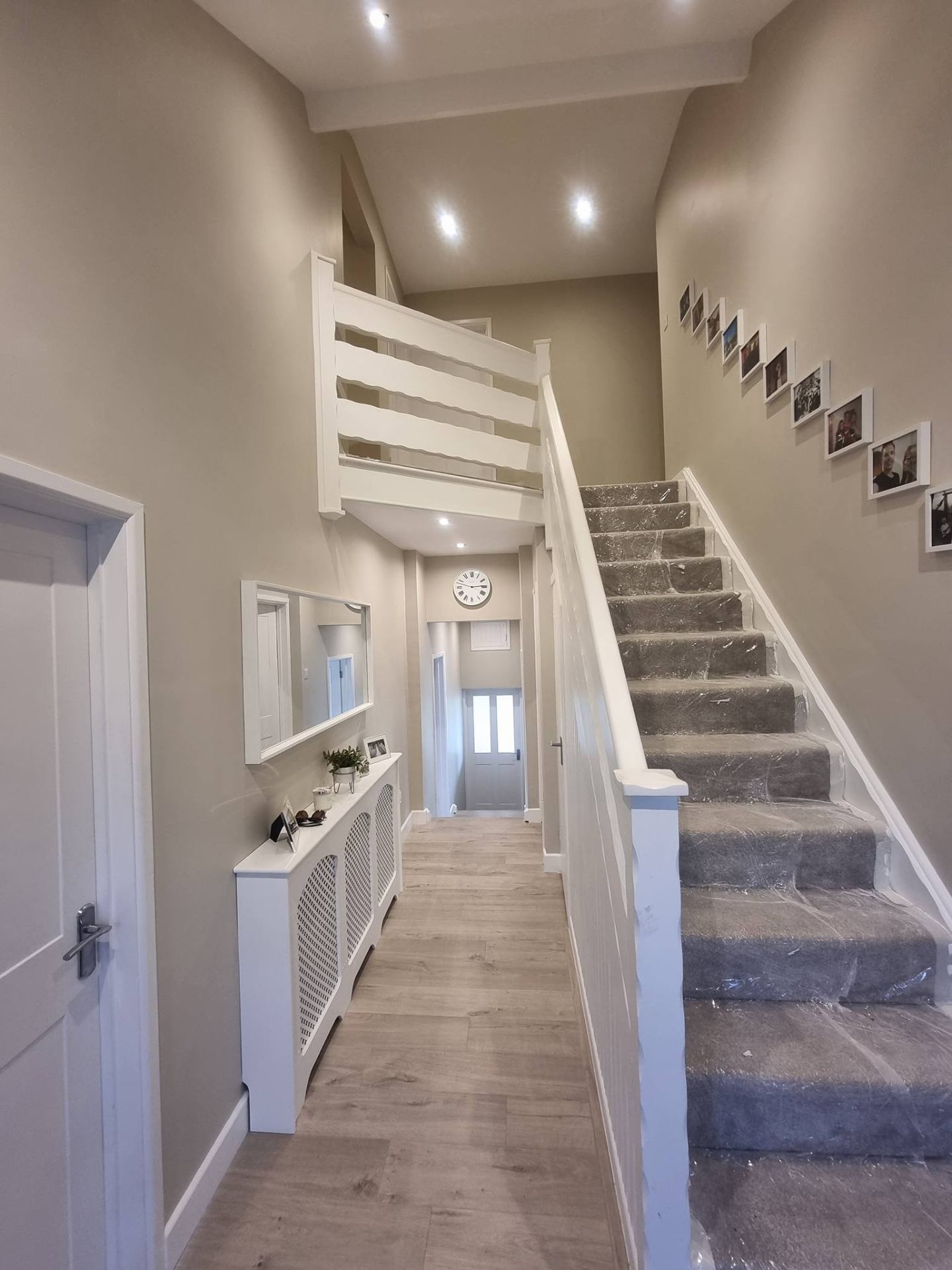 Built-in alcove cabinetry around a fireplace with crisp paint finish
