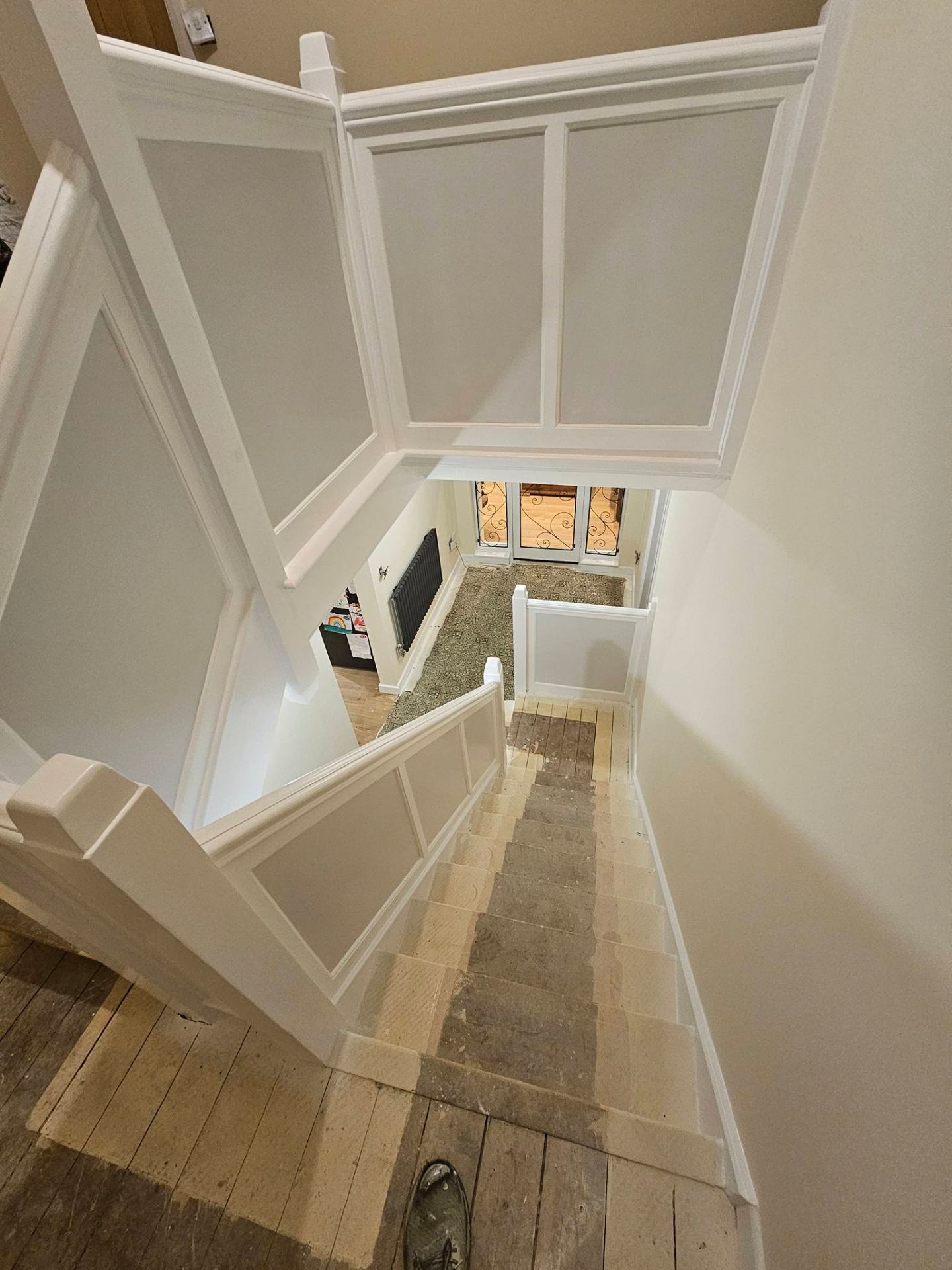 Bright stairwell with consistent paint finish and clean cut-in lines