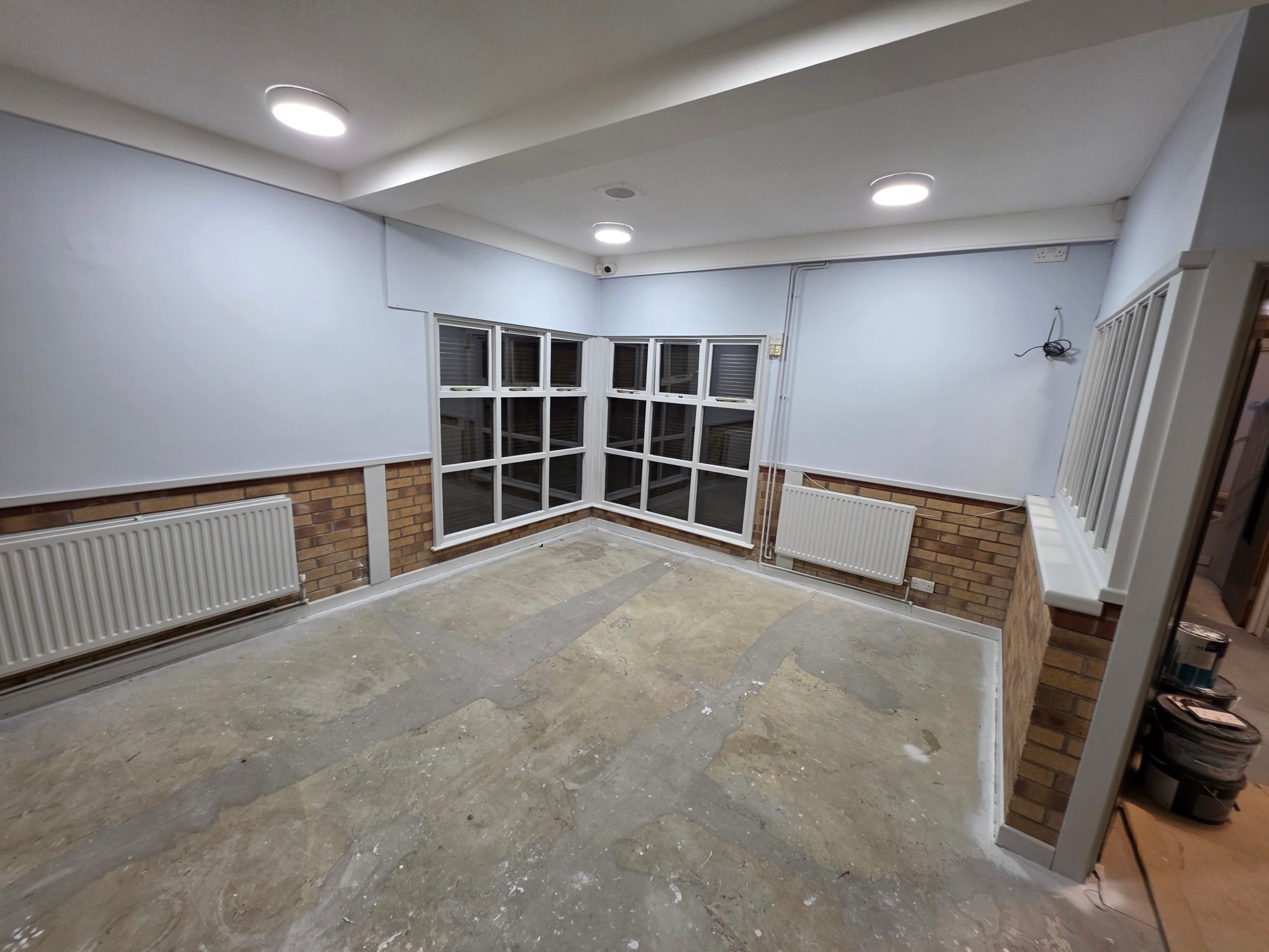 Repainted commercial space with fresh blue and white finish