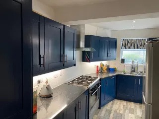 Sprayed navy kitchen cabinets — kitchen respray in South Wales — serving Monmouthshire