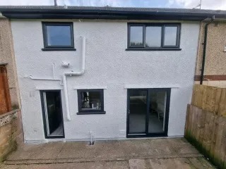 Smooth white render rear extension after full exterior repaint