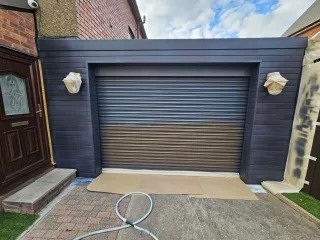 Anthracite-grey garage door after a full spray restoration
